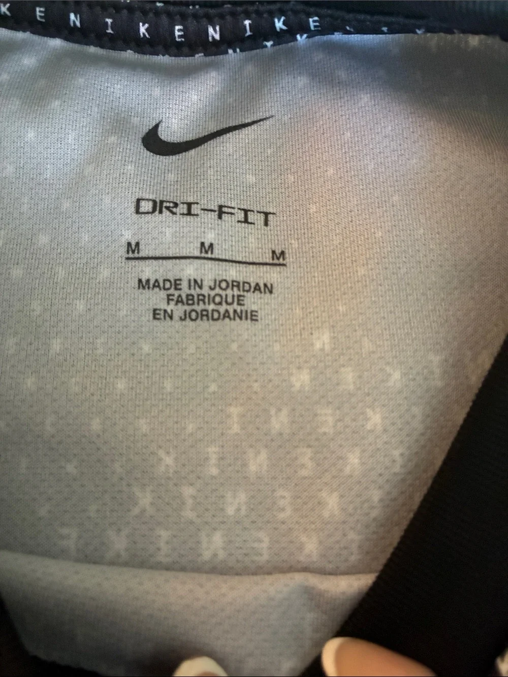 Nike Black Tee with White Micro-Text and Swoosh
